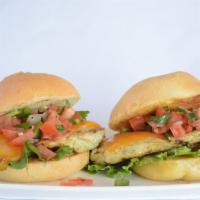 Taco Cheese Roost Slider · One premium chicken breast slider on a brioche bun topped with lettuce, salsa, and cheddar.
...