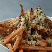 Parmesan Truffle Fries · Crispy french fries tossed with white truffle oil, parsley and shaved parmesan.  Served with...