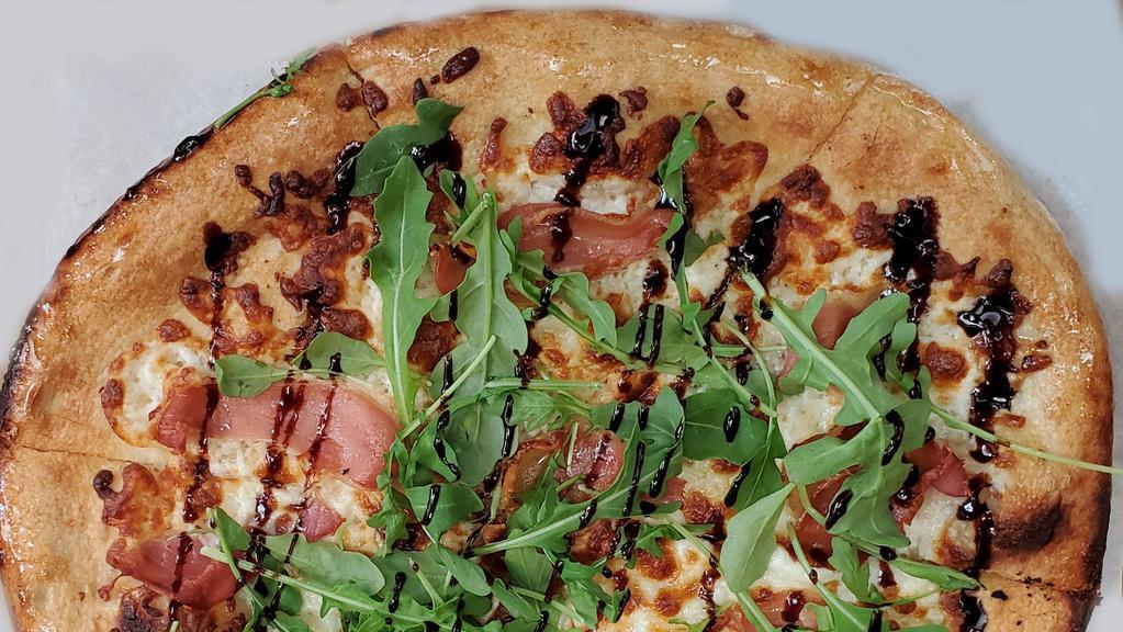 Arugula-Prosciutto · Topped with goat cheese, arugula, prosciutto, and balsamic glaze, bring a taste of Italy home with this gourmet classic.