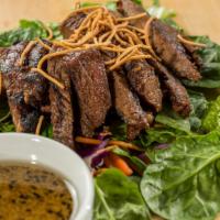 Grilled Steak Salad · Teriyaki steak on a bed of roman lettuce, spinach, red cabbage, carrots, tomatoes, cucumber,...