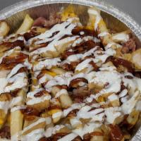Bbq Chicken Fries · French fries topped with chicken, bacon, mozzarella cheese, BBQ sauce drizzled with ranch dr...
