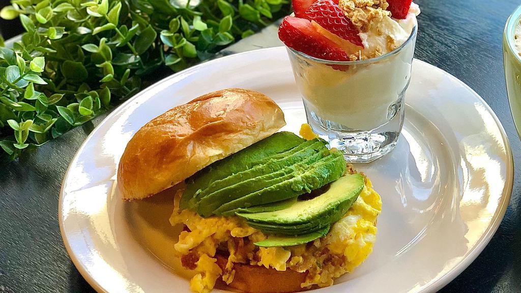 Breakfast At Tiffany'S · Brioche bun | scrambled eggs with bacon | avocado | house special sauce I side of Chips .