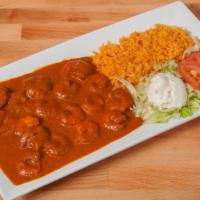 Camarones A La Diabla · Prawns sautéed with mushrooms in a spicy and savory red sauce. Served with rice, beans, and ...