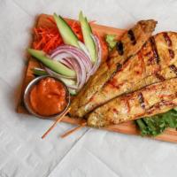 Chicken Satay (4) · Marinated grilled chicken skewers served with peanut sauce and small cucumber salad.