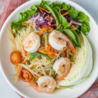 Papaya Salad · Papaya salad with carrots, garlic, green beans, tomatoes, peanut in lime and chili juice.

S...