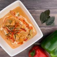 Panang Curry · Coconut milk with bell peppers and lime leaves in panang curry sauce.

Spicy in nature.