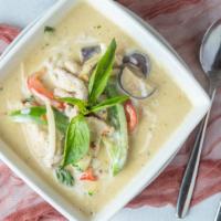 Green Curry · Coconut milk with zucchini, bamboo shoots, purple eggplant, bell peppers, and basil leaves i...