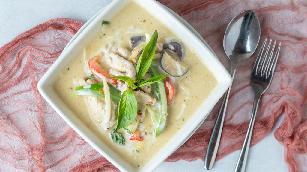 Green Curry · Coconut milk with zucchini, bamboo shoots, purple eggplant, bell peppers, and basil leaves in green curry sauce.

Spicy in nature.
