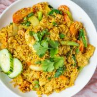 Pineapple Fried Rice · Stir-fried rice with chicken, egg, onions, pineapple, cashew nut, green onions, carrots, and...