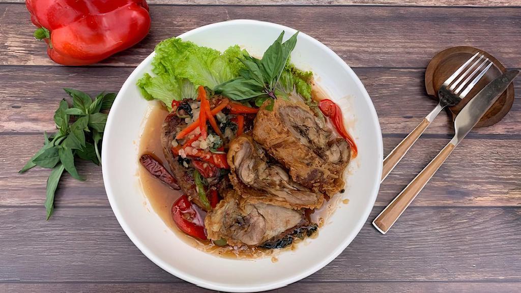 Fiery Crispy Duck · Crispy roasted duck in a sweet and spicy sauce with bell peppers, basil leaves.

Spicy in nature.