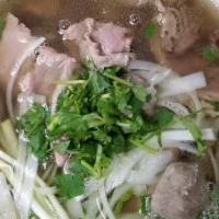 Special Combination Beef Noodle Soup · Slices of eye round steak, flank, shredded tripe, tendon, and meatballs.