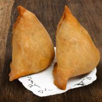Maharaja Samosa · Crispy pastry filled with spiced potatoes, peas, coriander, and cilantro served with mint an...