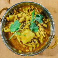 Aloo Tama Ra Bodi · Classic Nepali mountain dish, mountain bamboo shoots, potatoes, black eyed beans cooked with...