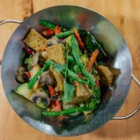 Monk Stir-Fry · Vegan. Tofu and mixed vegetables stir-fried in Tibetan style with garlic and ginger sauce.