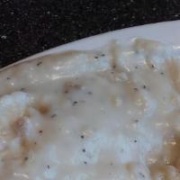 Biscuits & Gravy · Fresh biscuits topped with sausage gravy and served with two eggs cooked to your request.