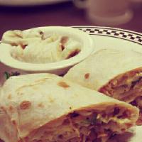 Breakfast Burrito · Your choice of ham, bacon or sausage wrapped with hash browns, eggs and Cheddar cheese. Serv...