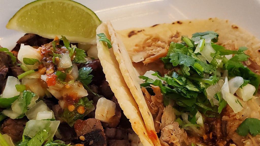 Tacos Asada Plate · Served with rice, refried beans, lettuce, pico and cheese.