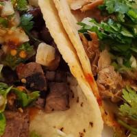 Tacos Lengua Plate · Served with rice, refried beans, lettuce, pico and cheese.