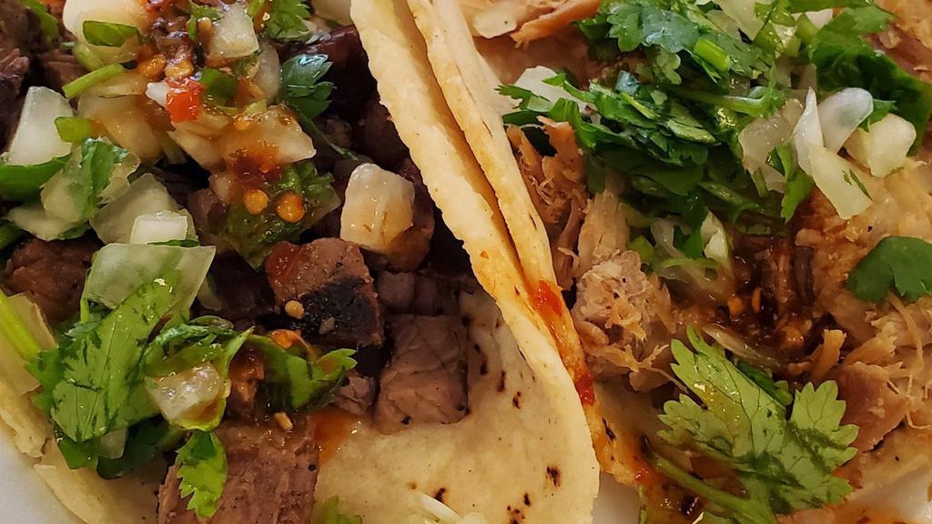 Tacos Lengua Plate · Served with rice, refried beans, lettuce, pico and cheese.
