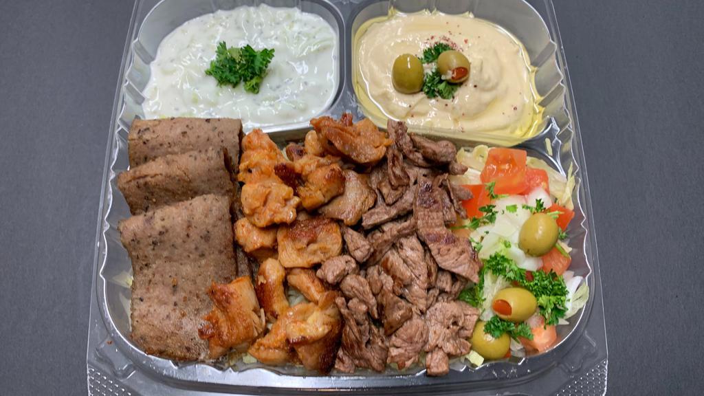 Triple Meat Plate With Pita Bread صـحن ثـلاث انـواع  · Chicken, beef, lamb, rice, pita, onion, tomato, tzatziki, lettuce, and choice of sauce. Hot sauce, garlic sauce.