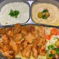 Chicken Plate With Pita Bread صـحن دجــاج · Chicken, rice, pita, onion, tomato, tzatziki, lettuce, and choice of sauce. Hot sauce, garli...