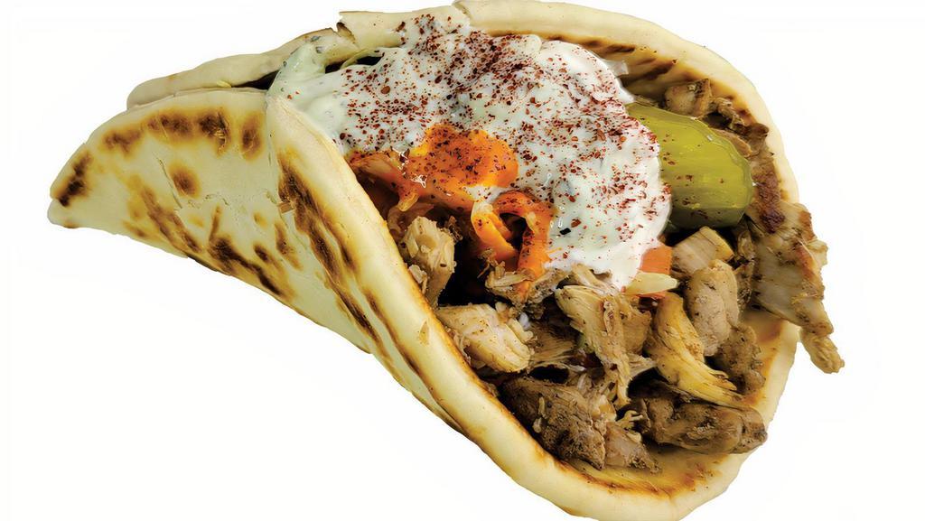 Large Chicken Gyro دجـاج جـايـرو  · Chicken, lettuce, tomato, pickles, onions, tzatziki, and choice of sauce. Hot sauce, garlic sauce.
