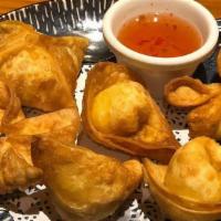 Crab Puffs (6) · Deep fried wontons stuffed with house made crab, cream cheese, and green onion mixture. Serv...
