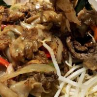 * 50. Pad Kee Mao (Drunken Noodles) · Wide rice noodles with egg, onions, bell peppers, tomatoes, mushrooms, and sweet basil.