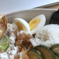 Crispy Chicken Bento · Fried chicken breast and sautéed zucchini topped with lime aioli dressing, over rice.