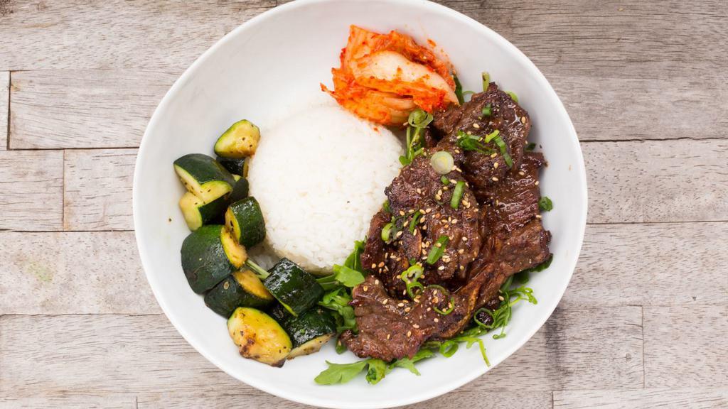 Korean Beef Bento · Marinated Korean beef bowl. Kimchi, rice, zucchini, and sesame.