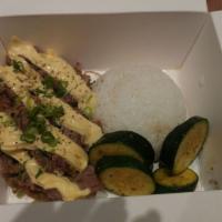 Hawaiian Bento · Stewed pork in pineapple gravy, sautéed zucchini, Kewpie mayo, and scallion, over rice.