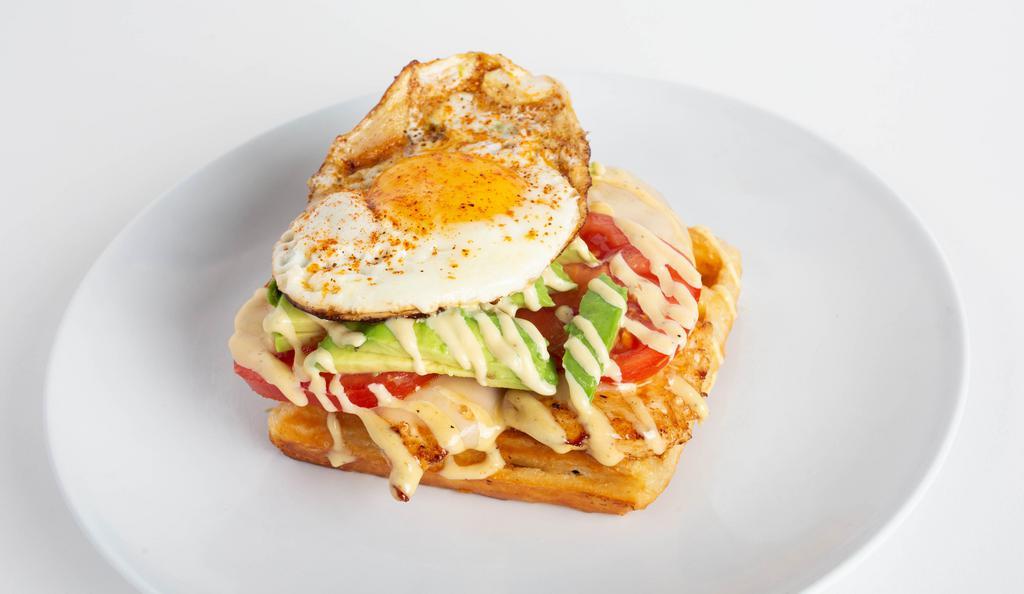 Chicken Avocado Tartine · Grilled chicken, cheese, fresh tomato, fresh avocado and a sunny-side-up egg.