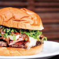 The Getting Figgy With It · 1/3 lb. patty topped with fig jam, brie cheese, hickory smoked bacon, rosemary, and arugula.