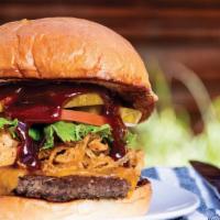 The Bbq Burger · 1/3 lb. patty with BBQ sauce, haystack onions, and cheddar cheese. Topped with lettuce, toma...