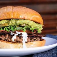 The Turkey Bacon Guac · Our 1/3 lb. turkey patty with hickory smoked bacon, and guacamole. Topped with lettuce, toma...