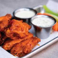Buffalo Chicken Wings · 7 crispy chicken wings tossed in our house made buffalo sauce and served with celery, carrot...