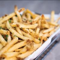Basket Parm Truffle Fries · Golden brown french fries tossed in a blend of parmesan cheese, truffle oil, and parsley.