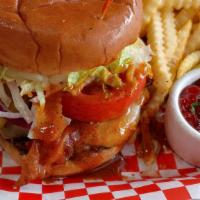 Backfire Burger · Four-alarm sauce, cheddar, pepper jack, bacon, lettuce, tomato, pickles, and onion on a brio...