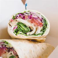 Smoky Blt Wrap · Our In-House Smoked Tofu, sweet & spicy coleslaw, lettuce, tomato, onion, potato salad and v...