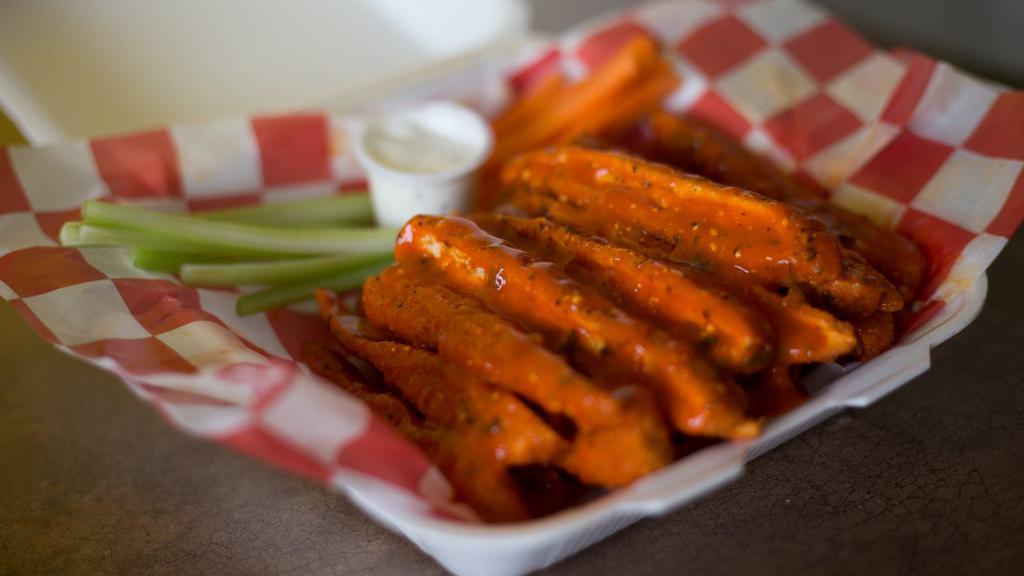 Spicy Chicken Fries · Fries topped with cheese, jalapeños, grilled chicken, red sauce and sour cream.