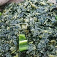 Gomen Wot · Finely chopped collard greens are cooked in their own steam with mild seasonings and olive o...