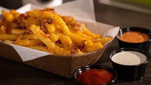 Cheese & Bacon Fries · Large order fries covered in melted cheese and bacon pieces.
