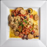 Veal Giuseppe · Veal scaloppini sautéed with spicy Italian sausage, onions, hot and sweet peppers, capers, o...