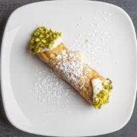 Cannoli · Crisp fried pastry tubes filled with sweetened ricotta and chocolate chips.