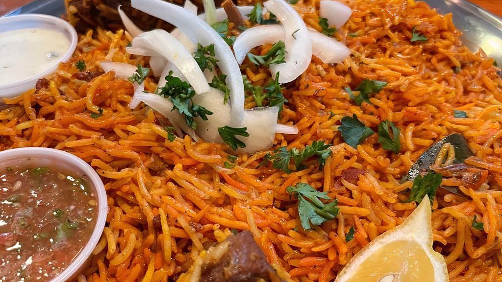 Kabsa Meat · Blend lamb meat with tomato sauce and seasoned rice.