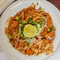 Pad Thai · Thin rice noodles with tofu, bean sprouts, green onions, ground peanuts, and shredded carrots.