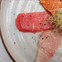 Carpaccio (Tuna, Salmon, And Yellowtail) · With ponzu, lemon zest, cracked pepper, olive oil, and white truffle oil.
