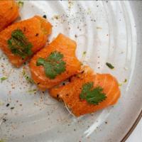 New Style Salmon · Salmon, organic sprouts, cilantro, jalapeno and ponzu sauce.