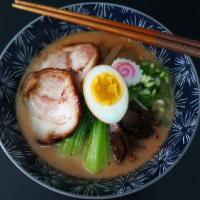 Spicy Miso Ramen · Roasted pork, boiled egg, bok choy, bamboo shoots, shiitake mushroom, enoki mushroom, fresh ...