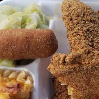 Fried Catfish Fillet Dinner · Favorite. Two catfish fillets with two sides, and hot water cornbread.